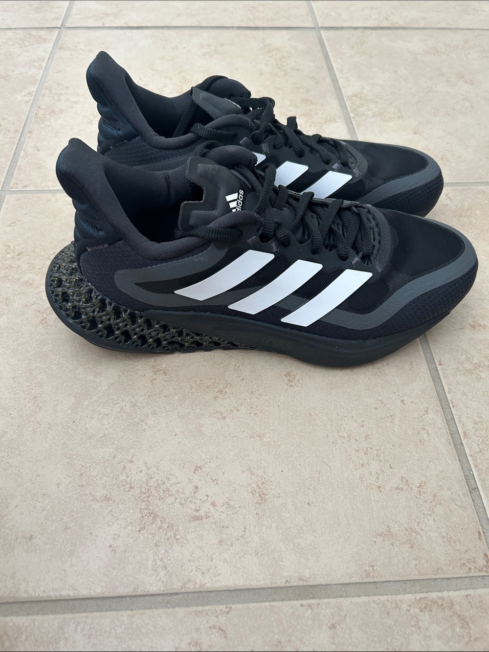 Adidas 4DFWD Pulse 2 sneakers in a black and white colorway